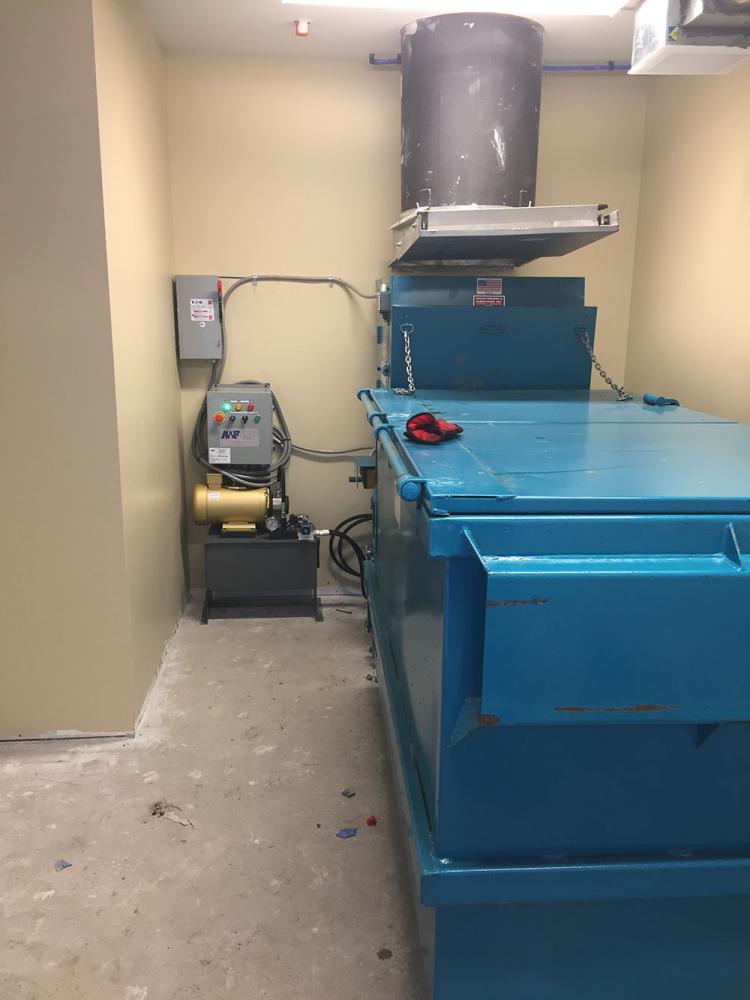 New Apartment-Style Trash Compactor with Containers