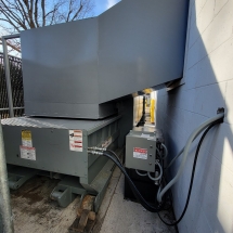 Self-contained compactor with a thru-the-wall chute in Massapequa, NY (Whole Foods)