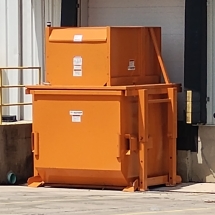 Wastequip OptiPak 8 YD compactor at dock 1 of 3